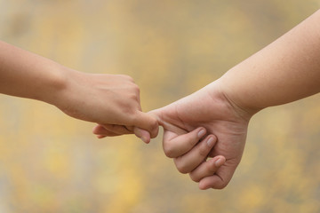 Closeup of loving couple holding hands