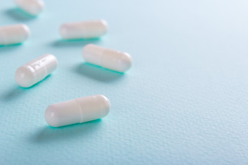 White  tablets on a green background
