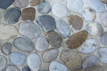 Gravel floor with many colors in many sizes. Walkway. Garden path.
