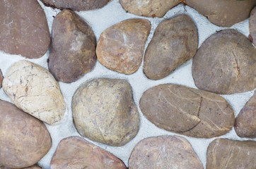 Gravel floor with many colors in many sizes. Walkway. Garden path.
