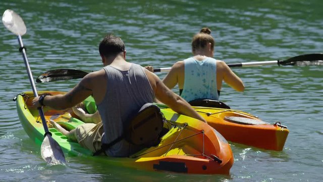 Couple kayaking in lake
