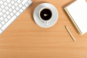 working place at wooden desktop with coffee