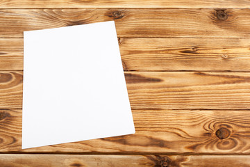 Blank paper on wood table