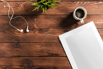 Blank book or magazine cover on wood background