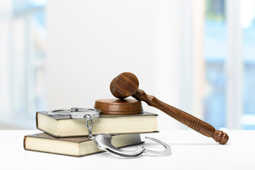 Gavel, books and handcuffs