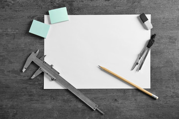 White paper and engineer supplies on table