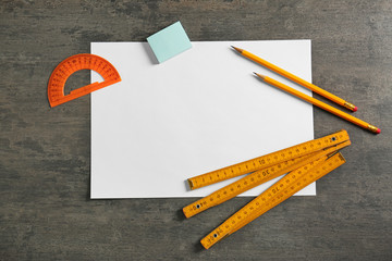 White paper and engineer supplies on table