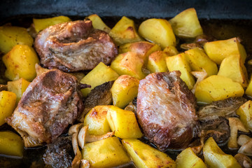 Pork roasted with mushrooms and potatoes