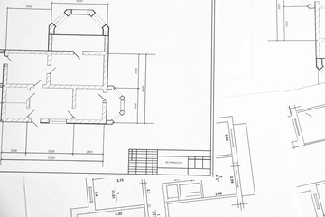 Engineering blueprints on table