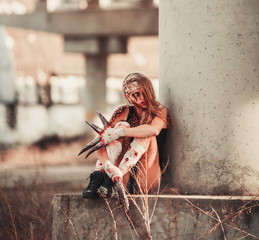 Mutant girl in wounds and ulcers with claws instead of fingers.