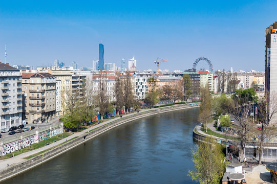 The cityscape of Vienna on a clear day around Danube Canal looking toward Praterstern with UNO City in the background.