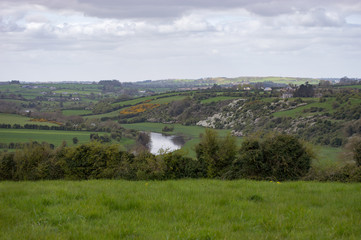 Springtime picture of the Irish countryside near Newgrange on a cloudy day.