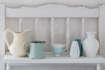  dinnerware on white wooden shelf