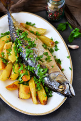 Baked mackerel with potatoes and spices for dinner