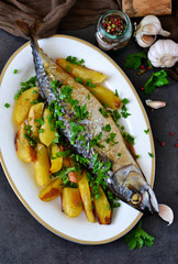 Baked mackerel with potatoes and spices for dinner