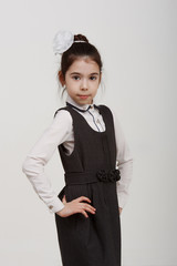 portrait of a young girl in school uniform and glasses