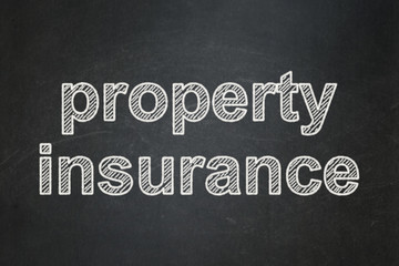 Obraz premium Insurance concept: Property Insurance on chalkboard background