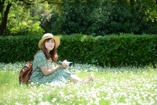 Asian woman is travel into flower garden.