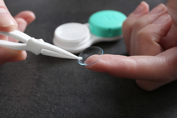 Female hands with contact lens, closeup
