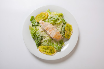 Caesar salad plate with cheese and garlic bread