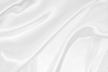 Smooth elegant white silk or satin luxury cloth texture as wedding background. Luxurious background design