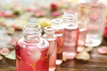 Perfume bottles on blurred background, closeup
