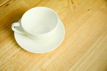 Top view  coffee mug  on wood table.