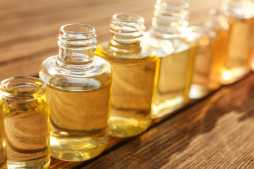Perfume bottles on wooden table