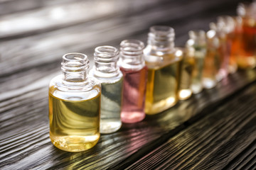 Perfume bottles on wooden table
