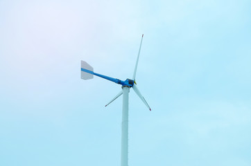 Wind turbines generating electricity with blue sky - energy conservation concept