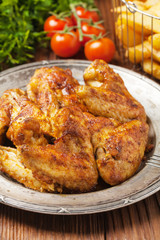 Baked wings, served with dip or baked potatoes.