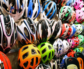 Stand with helmets on bicycle exhibition in showroom