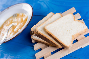 Preparing french toast with mixed eggs and sliced bread
