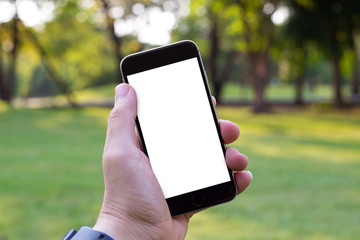 Man uses his Mobile Phone outdoor, close up, capture the moment by a smart phone in my hands.