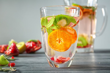 Fototapeta na wymiar Glass with fresh citrus cocktail on table