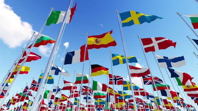 Flags of European countries on flagpoles waving on the wind against blue sky. View from below. Three dimensional rendering animation.