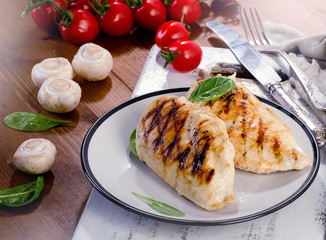 Grilled chicken breasts with vegetables