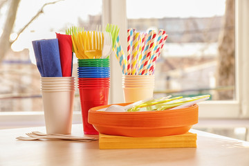 Colorful plastic ware for picnic on table