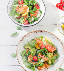 Fresh Salmon salad with cherry tomatoes,  arugula, and avocado