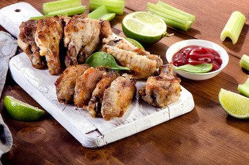 Grilled Chicken wings on a wooden board