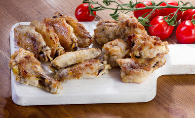 Grilled Chicken wings on a cutting board.