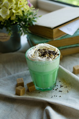Green mint coffee with with cream and colorful decoration. Milk shake, cocktaill, frappuccino.  Unicorn coffee, unicorn food.
