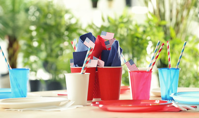 Table setting with plastic ware for summer picnic © Africa Studio