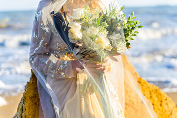 The bride holds bouquet