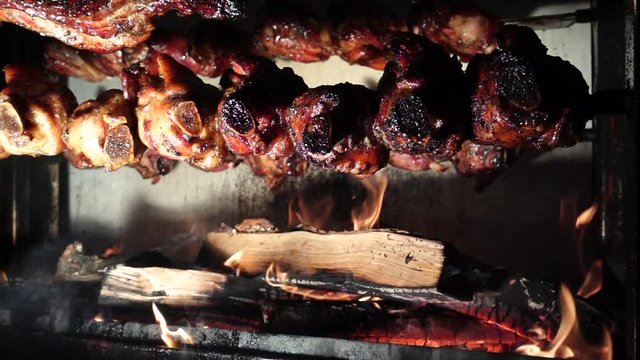 Roast chicken on grill with wood baking. Super Slow Motion
