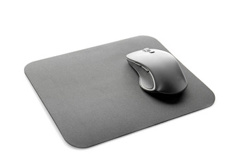 Modern wireless mouse and pad on white background