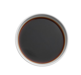Bowl with tasty soy sauce on white background