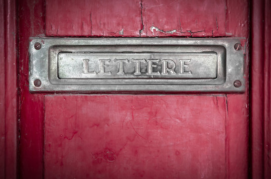 Letter box in a red door
