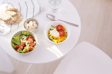 Composition with tasty yogurt on table in room