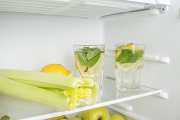 Open fridge full of fresh fruits and vegetables